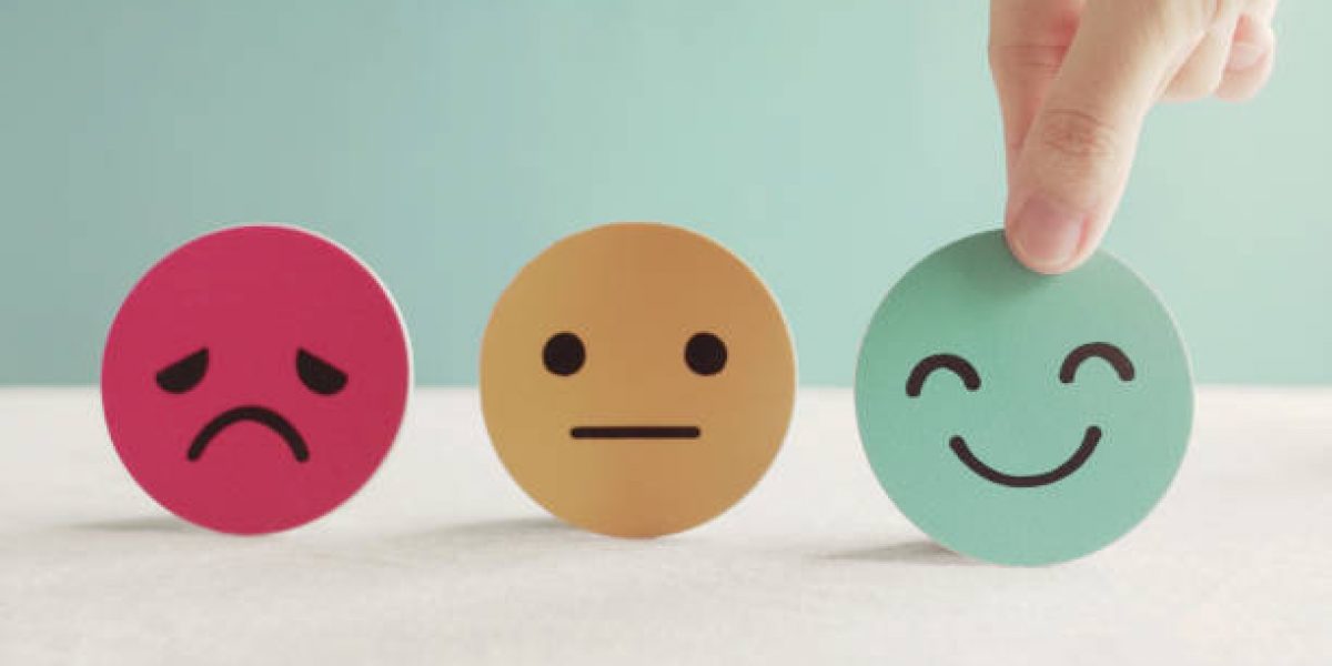 Hand choosing green happy smiley face paper cut, product, user, service feedback rating and customer reveiw, experience, satisfaction survey, psychology mental health test concept